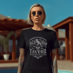 Person wearing a black t-shirt with 'Old Crow Tavern' design outdoors.