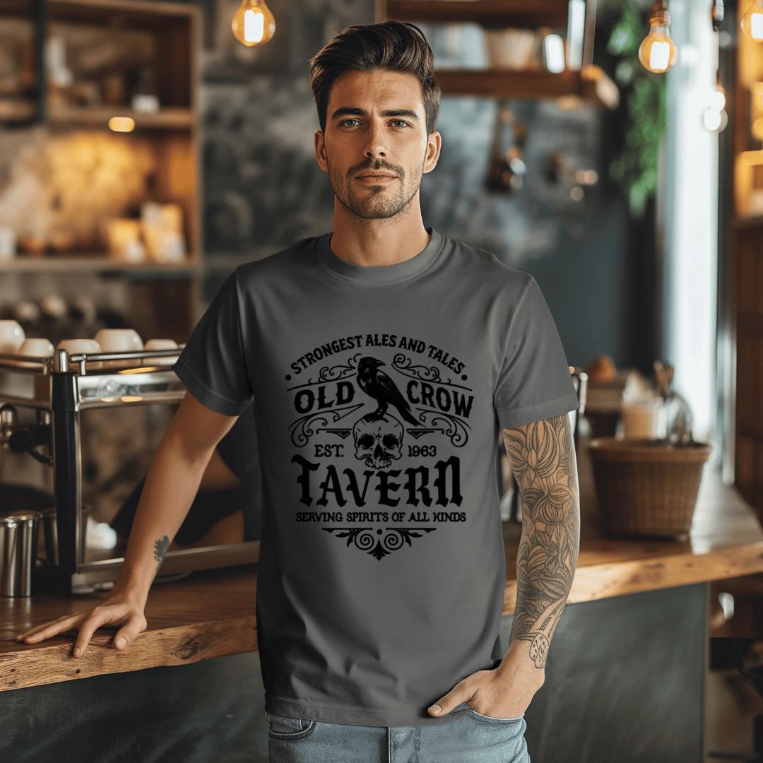 Man wearing a dark gray t-shirt with 'Old Crow Tavern' design in a bar setting