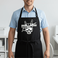 Black professional barber apron with white skull rock hand gesture and styling tools worn by male barber