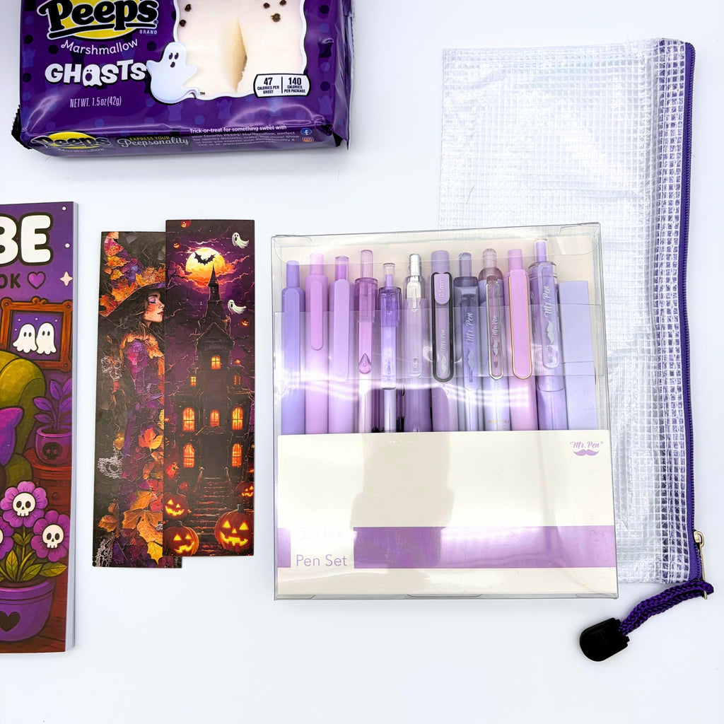 Halloween bookmarks with a witch and a haunted house beside a lilac gel pen set, clear mesh zipper pouch, and marshmallow ghosts