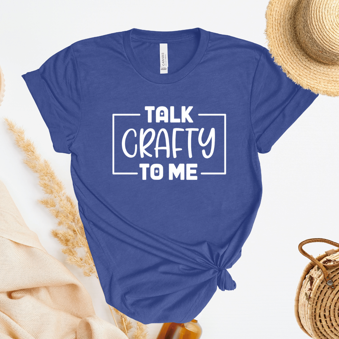 Blue t-shirt with 'Talk Crafty to Me' text on a light background