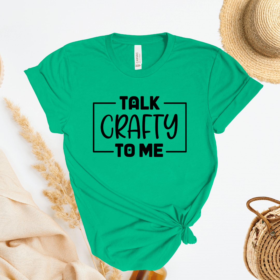 Green t-shirt with 'Talk Crafty to Me' text on a white background