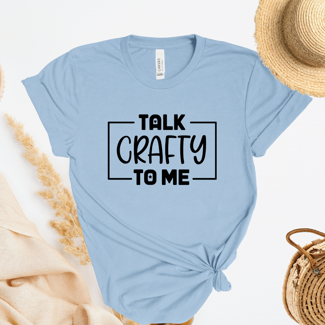 Light blue t-shirt with 'Talk Crafty to Me' text on a white background