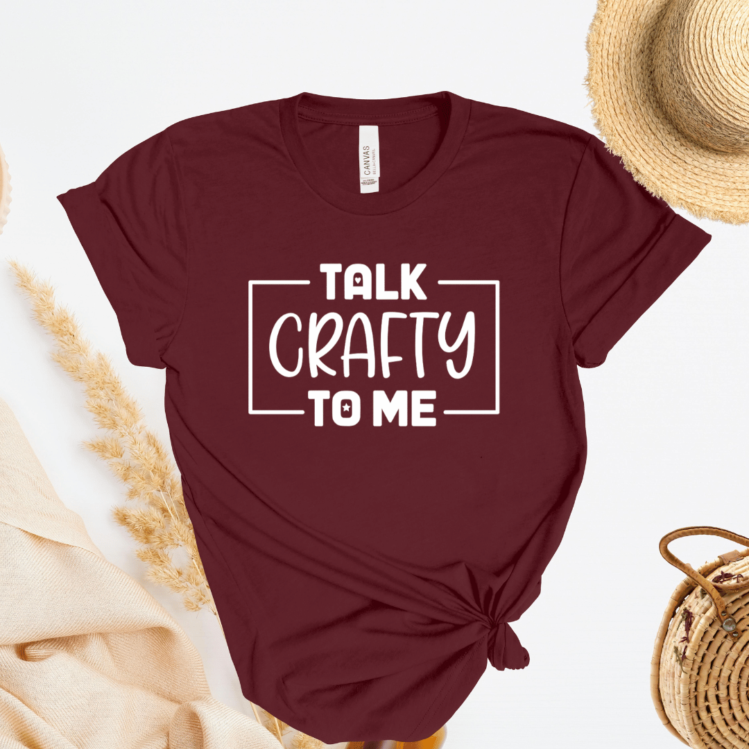 Maroon t-shirt with 'Talk Crafty to Me' text on a light background