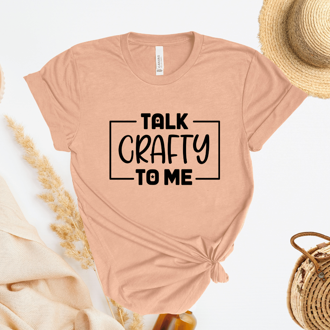 Peach t-shirt with 'Talk Crafty to Me' text on a light background