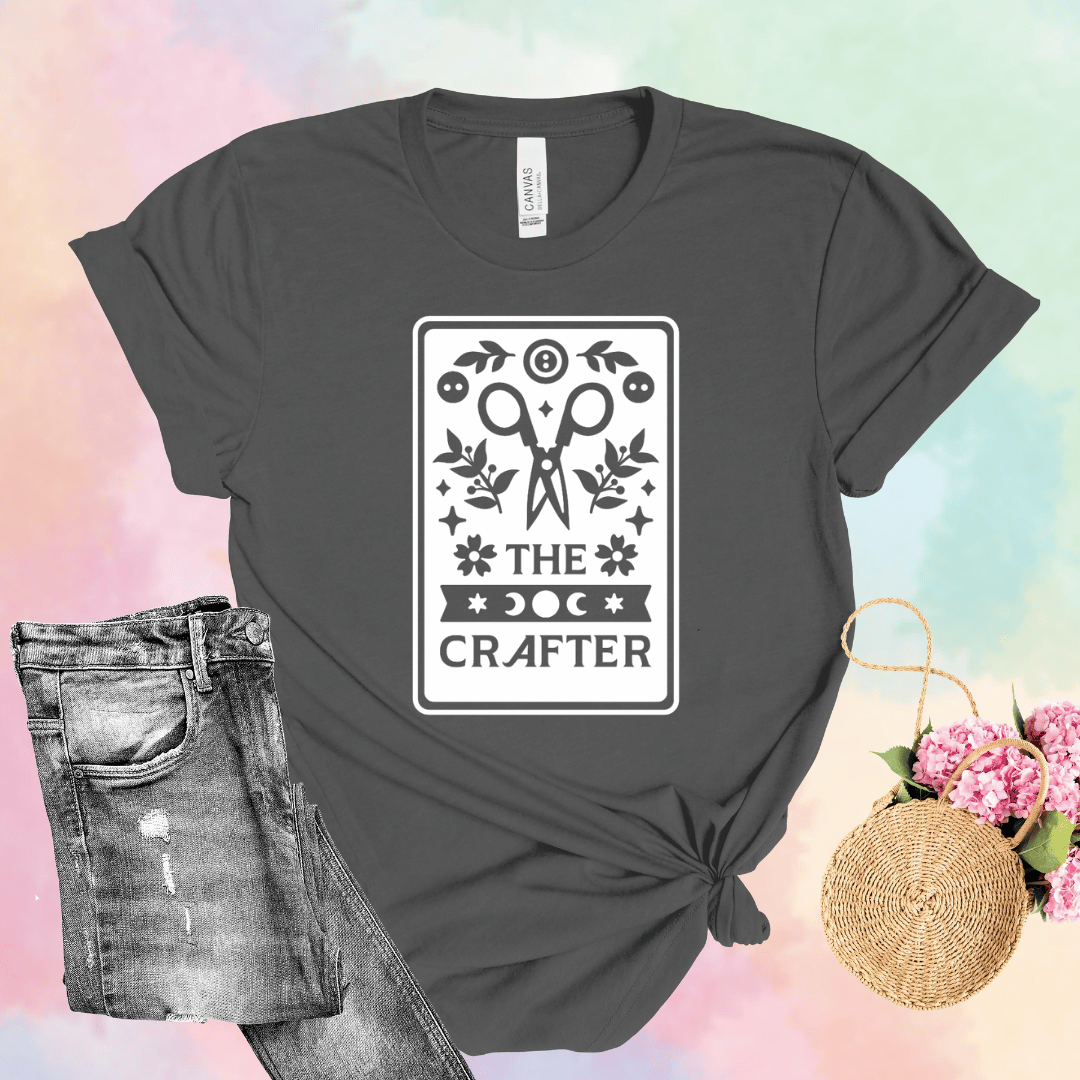 The Crafter tarot card t-shirt in dark gray with scissors, botanicals, and moon phase design