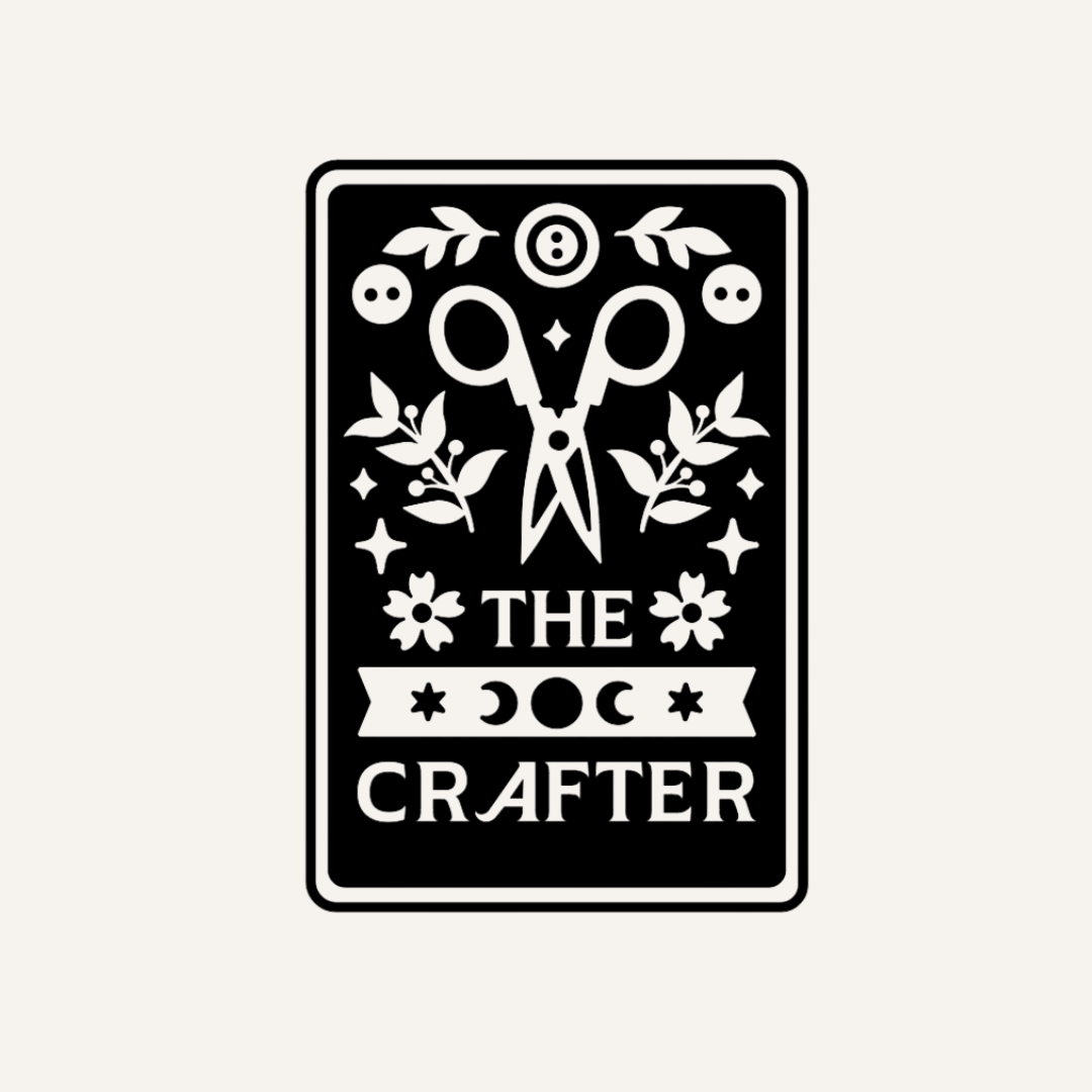 The Crafter tarot card graphic in natural tan with scissors, botanicals, and moon phase design